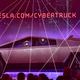 People take pictures of the newly unveiled all-electric battery-powered Tesla’s Cybertruck with shattered windows after a failed resistance test on November 21, 2019.
